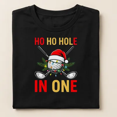 Colorful cartoon golf ball wearing a Santa hat with text 'HO HO HOLE IN ONE' — printed on a women's shirt