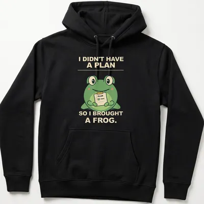 Cartoon frog with humorous text about spontaneity in green and beige — printed on a unisex hoodie
