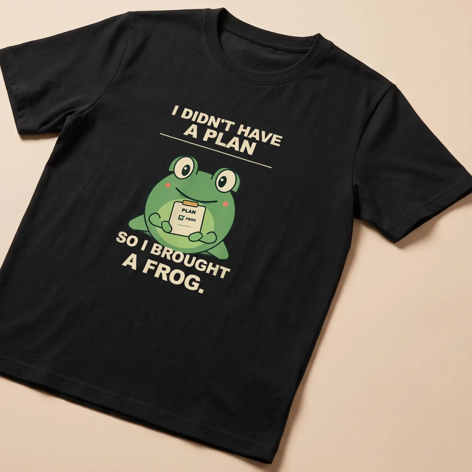 Cartoon frog with humorous text about spontaneity in green and beige — printed on a unisex t-shirt