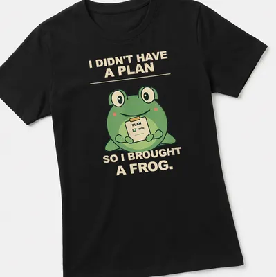 Cartoon frog with humorous text about spontaneity in green and beige — printed on a women's shirt