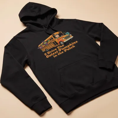Cartoon-style shirt featuring a school bus with pumpkins and characters for Halloween. — printed on a unisex hoodie