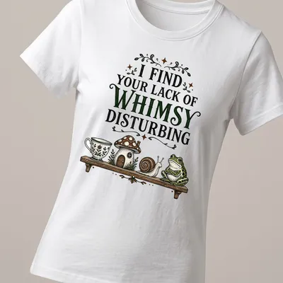 Vintage frog and snail T-shirt with whimsical text and cottage illustration — printed on a women's shirt