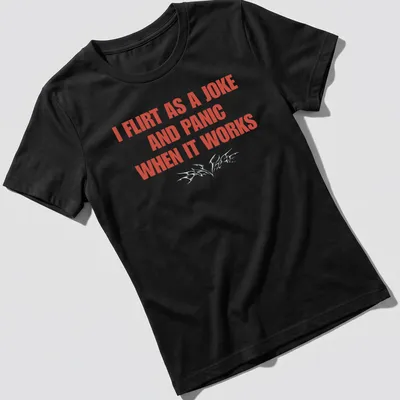 Bold typography shirt reading I Flirt As A Joke And Panic When It Works — printed on a women's shirt