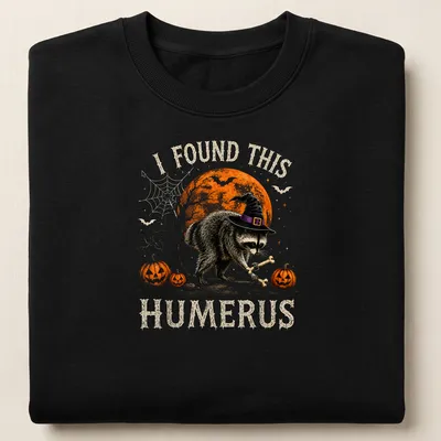 Whimsical raccoon illustration with humorous text for Halloween — printed on a unisex sweatshirt