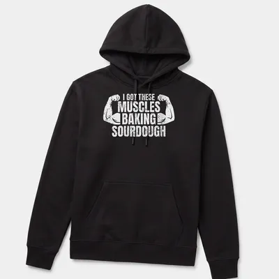 Distressed T-shirt with flexing arms and humorous baking text — printed on a unisex hoodie