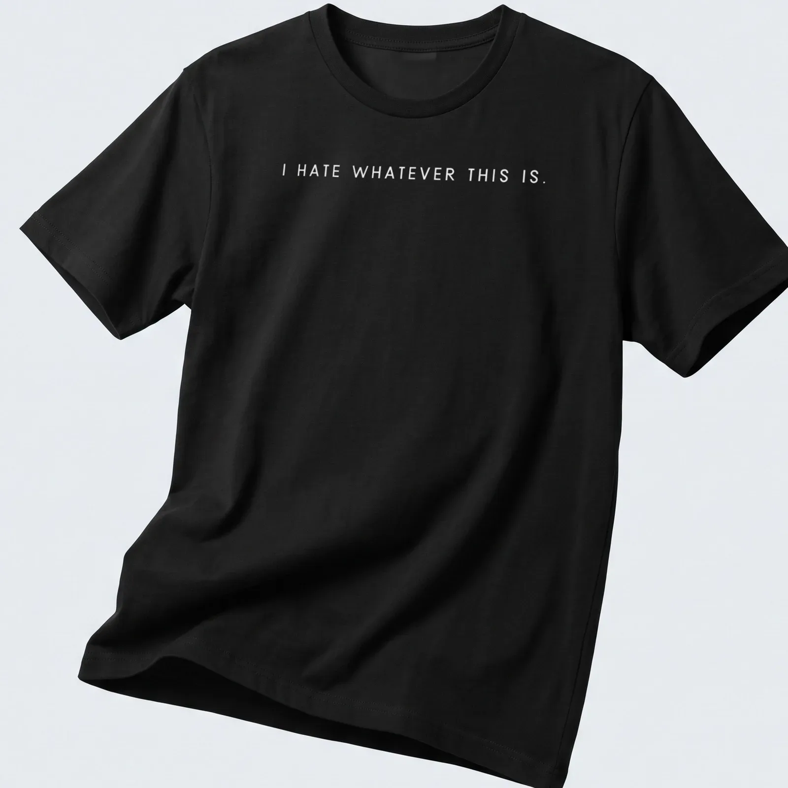 Minimalist statement t-shirt featuring the text 'I Hate Whatever This Is' in bold black letters — printed on a unisex t-shirt