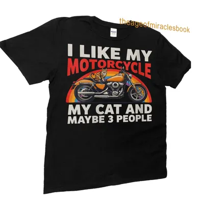Colorful retro design T-shirt featuring a motorcycle and a cat with playful text — printed on a unisex t-shirt (angled view)