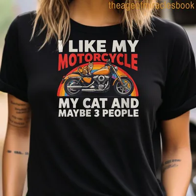 Colorful retro design T-shirt featuring a motorcycle and a cat with playful text — printed on a women's t-shirt