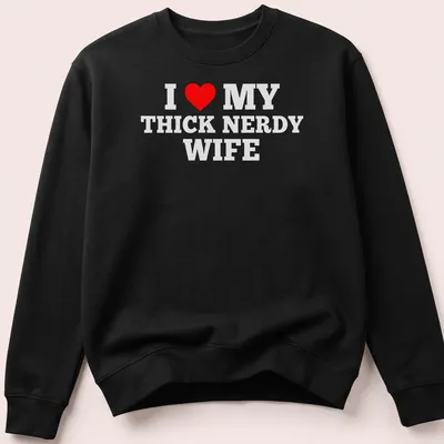 Bold text design declaring love for a thick nerdy wife with a heart symbol — printed on a unisex sweatshirt