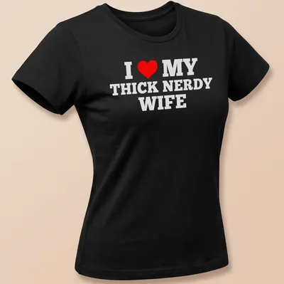 Bold text design declaring love for a thick nerdy wife with a heart symbol — printed on a women's shirt