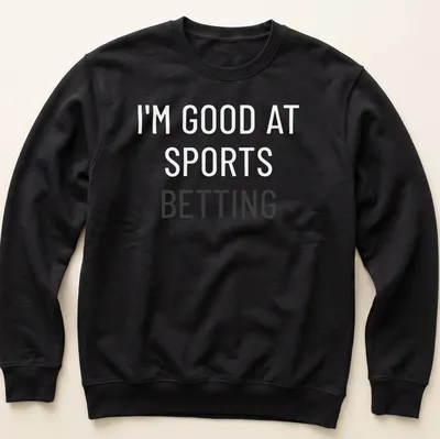Bold typography shirt stating I'm Good At Sports Betting — printed on a unisex sweatshirt