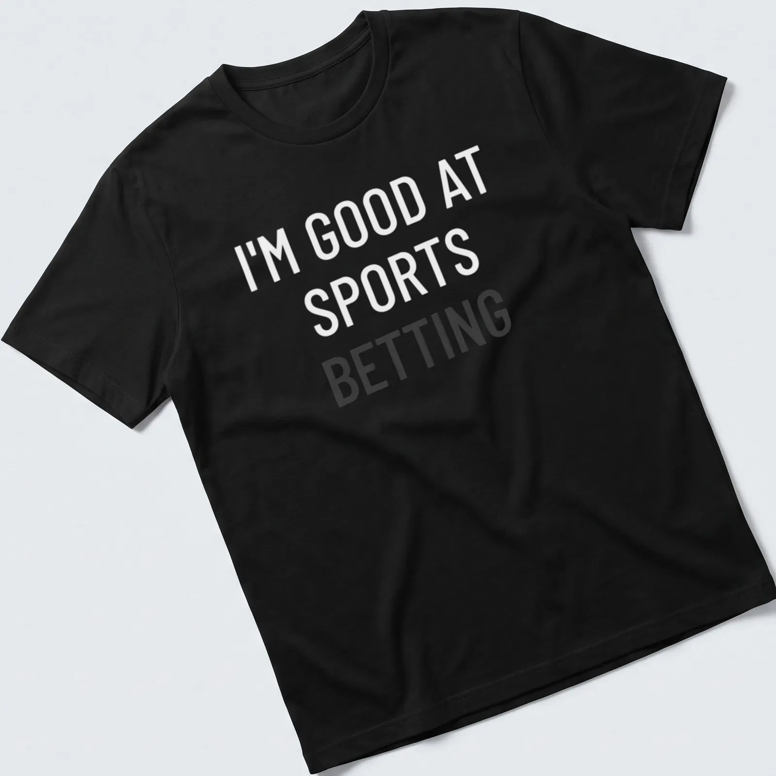 Bold typography shirt stating I'm Good At Sports Betting — printed on a unisex t-shirt