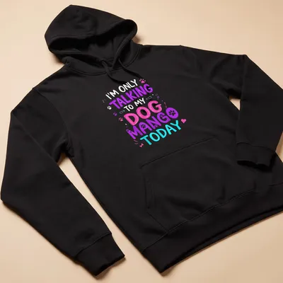 Playful tee featuring colorful text about talking to a dog named Mango — printed on a unisex hoodie