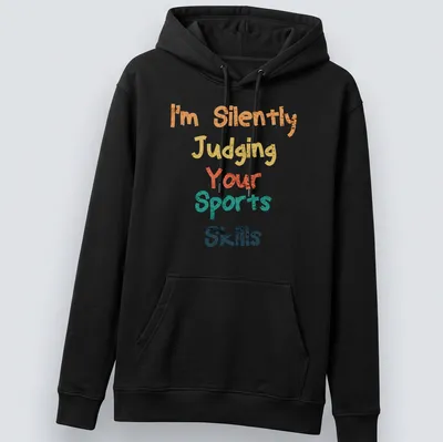 Colorful typography shirt with playful text about judging sports skills — printed on a unisex hoodie