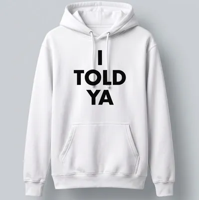 Bold typography t-shirt with the text 'I TOLD YA' in black and white — printed on a unisex hoodie