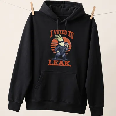 Funny tactical leek character with the phrase I Voted To Leak printed above. — printed on a unisex hoodie