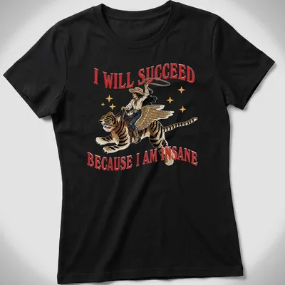 Vintage illustration of a cowgirl riding a tiger with bold text above — printed on a women's shirt