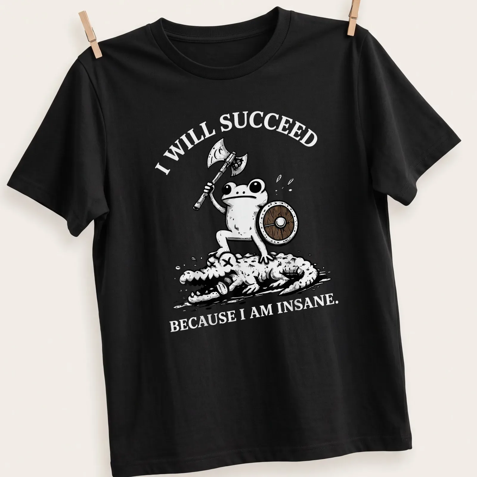 Cartoon frog warrior with the text 'I WILL SUCCEED BECAUSE I AM INSANE.' — printed on a unisex t-shirt