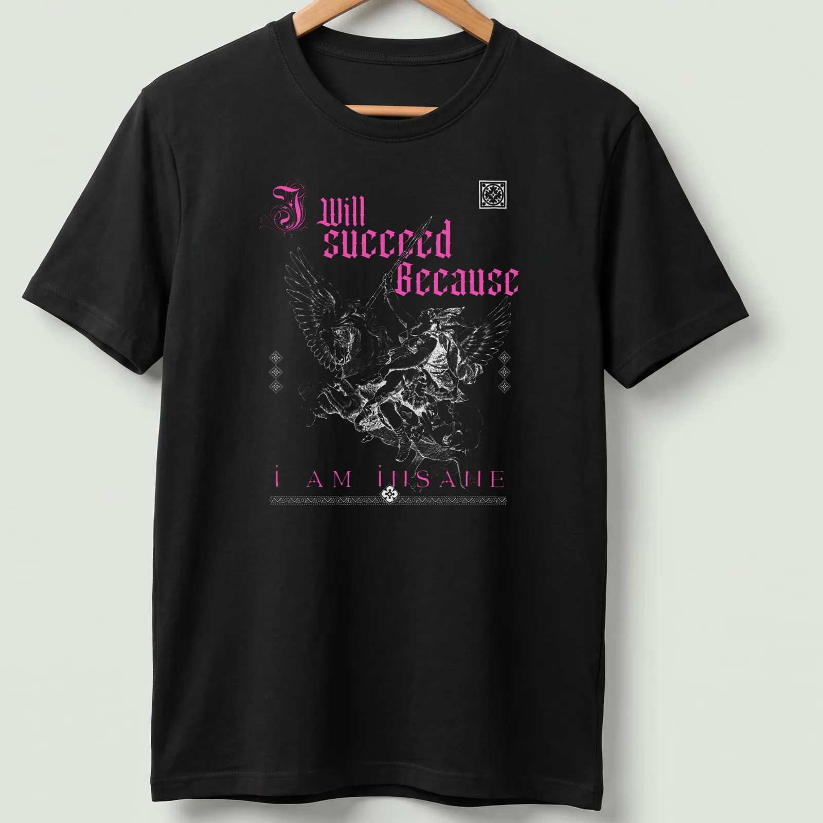Gothic text 'I Will Succeed Because I Am Insane' with a winged warrior in pink and white. — printed on a unisex t-shirt