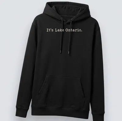 Typographic design featuring the phrase It's Lake Ontario on a beige background — printed on a unisex hoodie