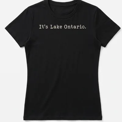 Typographic design featuring the phrase It's Lake Ontario on a beige background — printed on a women's shirt