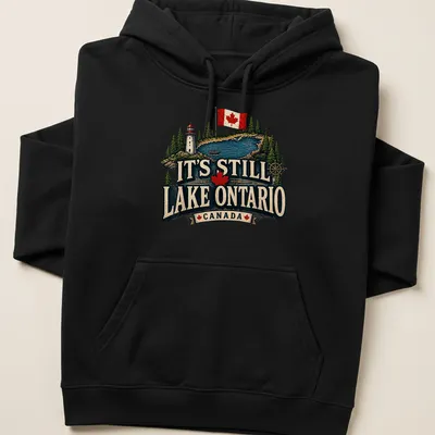 Vintage rustic T-shirt featuring Lake Ontario, a lighthouse, and a boat in green, blue, red, cream, and black — printed on a unisex hoodie
