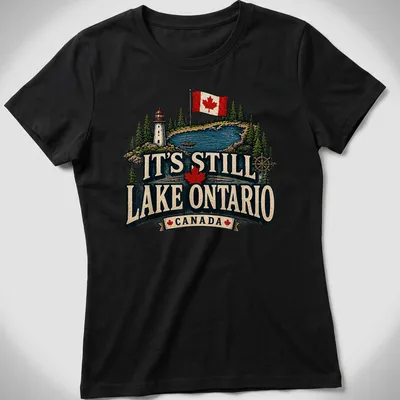 Vintage rustic T-shirt featuring Lake Ontario, a lighthouse, and a boat in green, blue, red, cream, and black — printed on a women's shirt