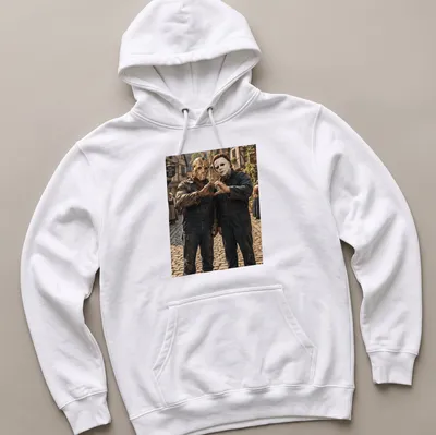 Realistic print of Jason Voorhees and Michael Myers forming heart hands — printed on a unisex hoodie