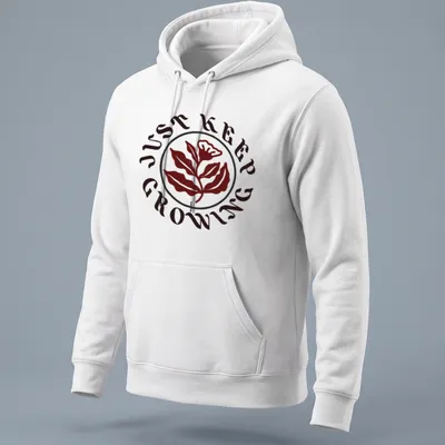 Floral design with leaves and text 'JUST KEEP GROWING' in dark red, green, and white — printed on a unisex hoodie