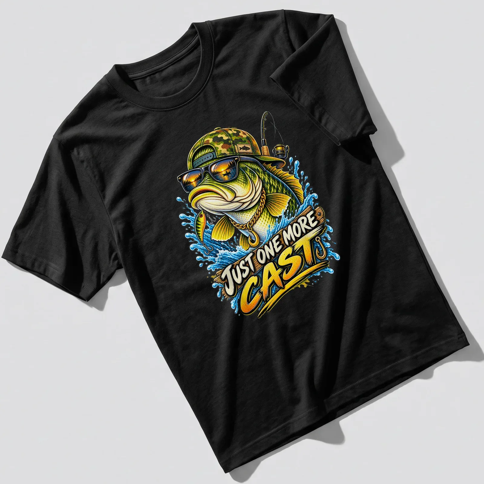 Colorful illustration of a bass fish wearing sunglasses and a cap with text Just One More Cast — printed on a unisex t-shirt