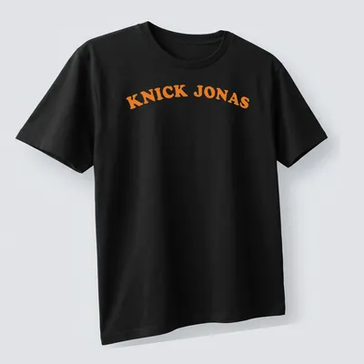 Bold typography of Knick Jonas printed in orange with a basketball pun — printed on a unisex t-shirt (angled view)