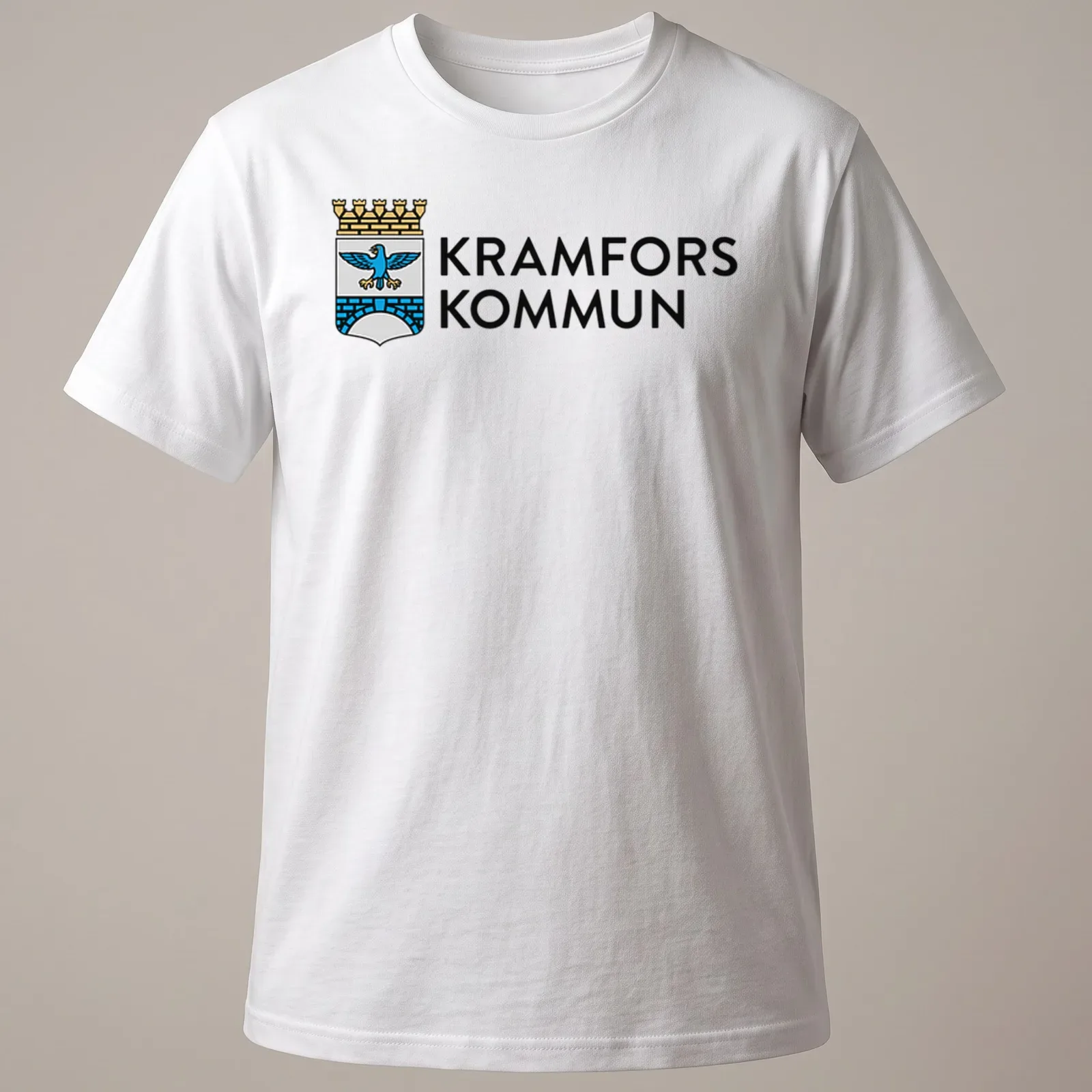 Kramfors Kommun logo t-shirt featuring a coat of arms design in blue, gold, and white — printed on a unisex t-shirt