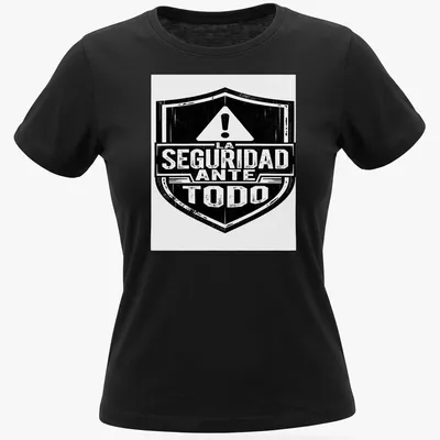 Vintage distressed t-shirt with a safety shield and text 'LA SEGURIDAD ANTE TODO' — printed on a women's shirt