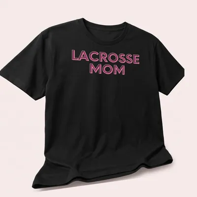Bold Lacrosse Mom t-shirt with pink and white typography — printed on a unisex t-shirt (angled view)