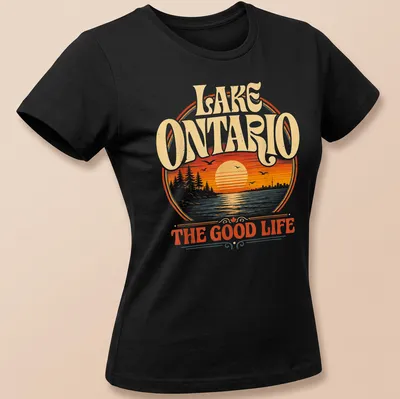 Retro sunset scene over Lake Ontario with text in warm colors — printed on a women's shirt