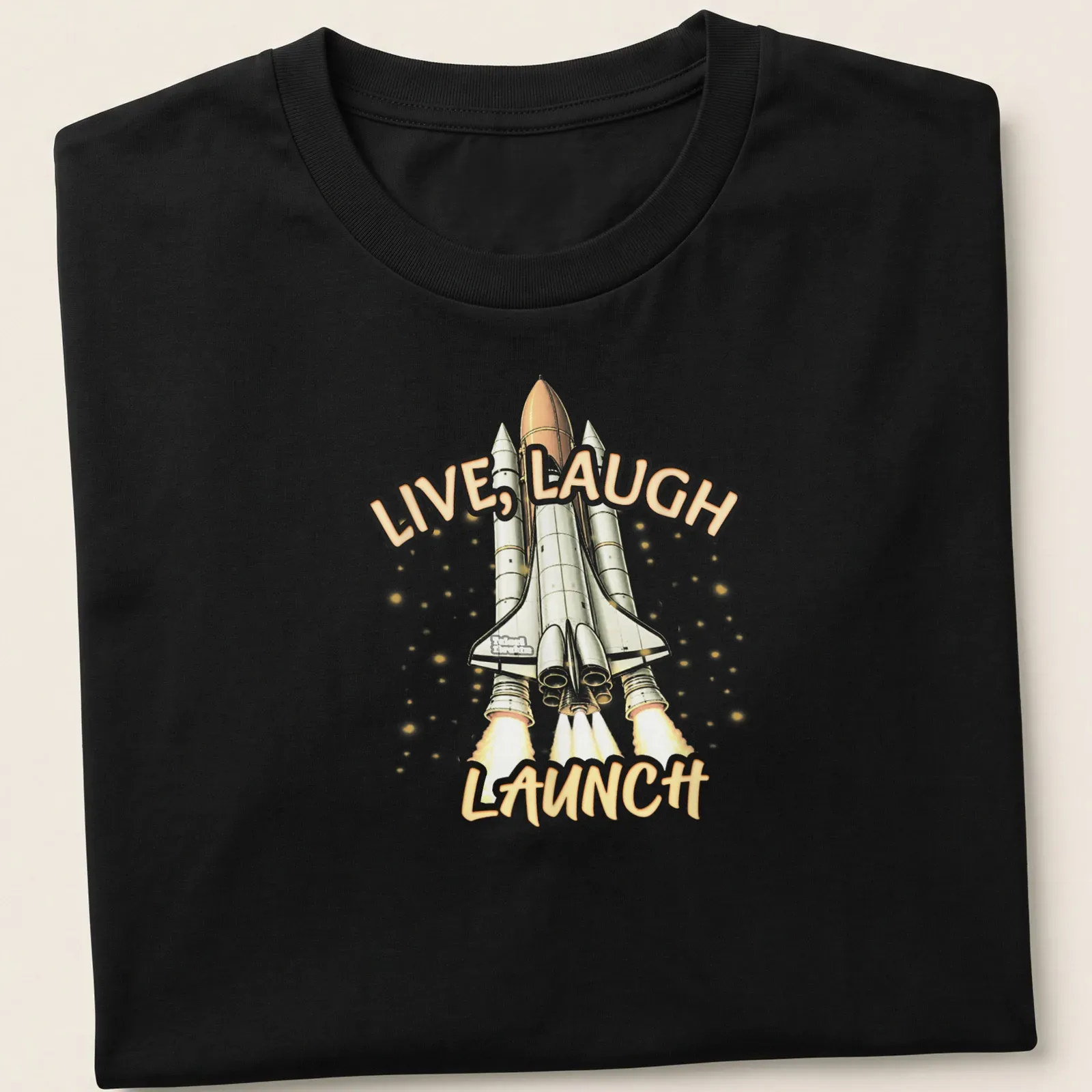 Cartoon rocket graphic with the phrase Live, Laugh, Launch in orange and gray — printed on a unisex t-shirt