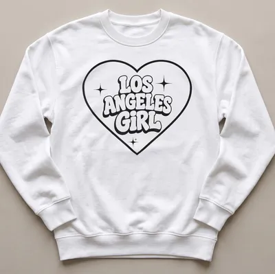 Bold retro Los Angeles Girl T-shirt with heart design in black and white — printed on a unisex sweatshirt