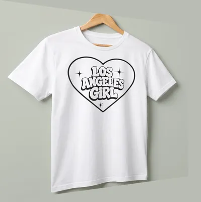 Bold retro Los Angeles Girl T-shirt with heart design in black and white — printed on a unisex t-shirt (angled view)