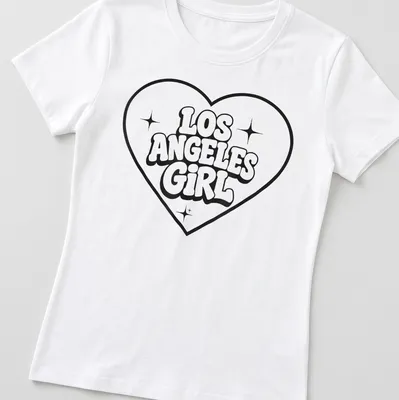 Bold retro Los Angeles Girl T-shirt with heart design in black and white — printed on a women's shirt