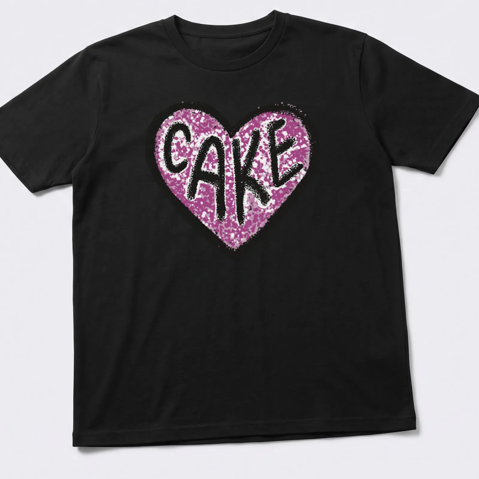 Glittery Love Cake t-shirt featuring a heart design in pink, black, and white — printed on a unisex t-shirt