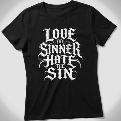 Gothic lettering T-shirt featuring 'Love The Sinner Hate The Sin' in black and white. — printed on a women's shirt