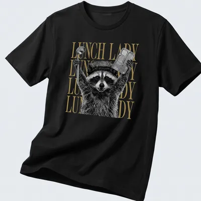Black and white graphic of a raccoon with bold gold text saying Lunch Lady
