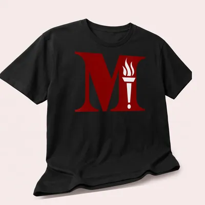 Bold graphic of a torch emblem with the letter M in red and white — printed on a unisex t-shirt (angled view)
