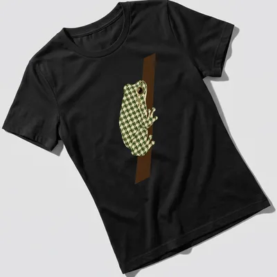 Geometric illustration of a minimalist tree frog in green and cream tones. — printed on a women's shirt