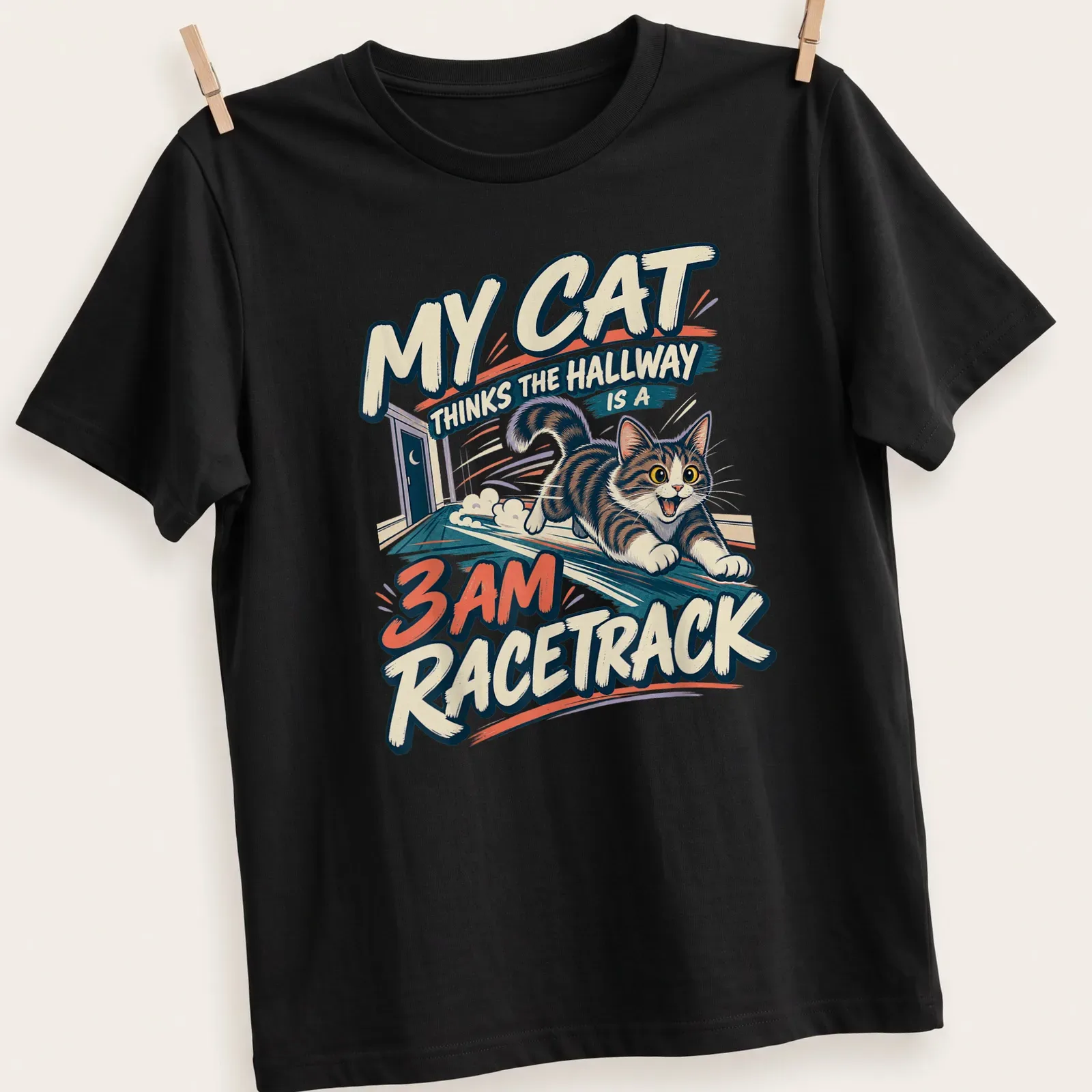 Vintage cartoon T-shirt featuring a playful tabby cat with humorous text about racing in the hallway — printed on a unisex t-shirt