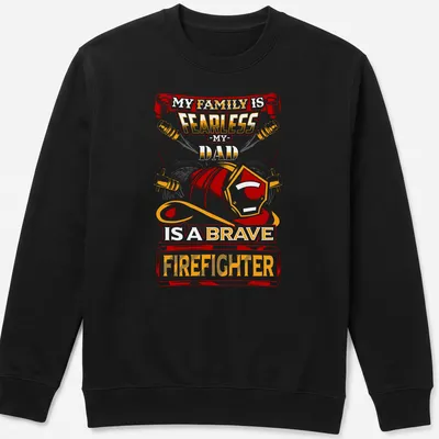 Vintage firefighter t-shirt with bold text and helmet graphic in red, orange, yellow, and black — printed on a unisex sweatshirt