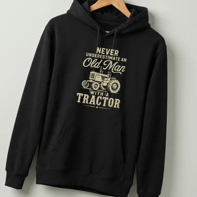 Vintage tractor graphic with humorous text about old men and tractors — printed on a unisex hoodie