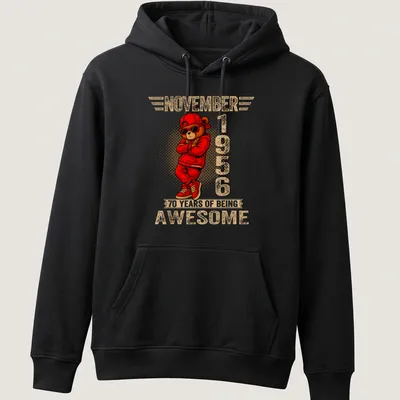 Cartoon teddy bear with colorful text celebrating 70 years of being awesome — printed on a unisex hoodie