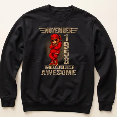 Cartoon teddy bear with colorful text celebrating 70 years of being awesome — printed on a unisex sweatshirt