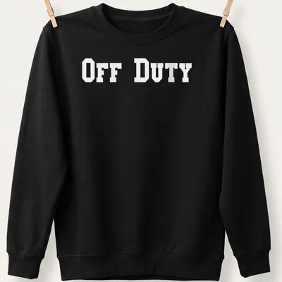 Bold typography t-shirt saying 'OFF DUTY' in large letters. — printed on a unisex sweatshirt